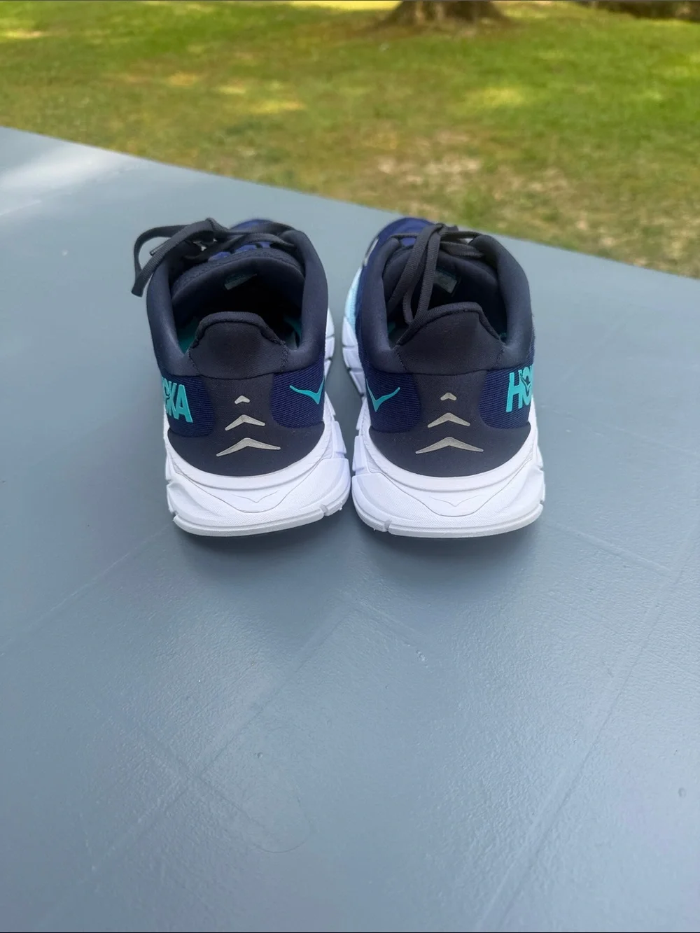 Hoka Navy Running Shoes with Aqua Accents. Wide shoes